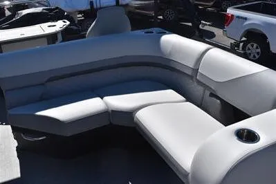 Slide: The Image of 2026 Lowe SF 212 Sport Fish boat interior with plush seating and cup holder. - 19