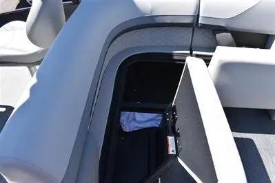 Slide: The Image of 2026 Lowe SF 212 Sport Fish boat interior with open storage compartment. - 21