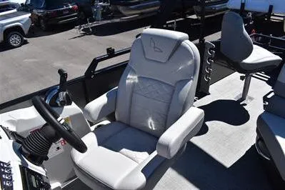 Slide: The Image of 2026 Lowe SF 212 Sport Fish boat interior with comfortable seating and steering wheel. - 27