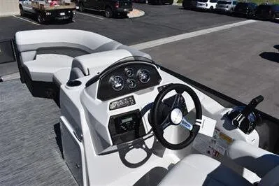 Slide: The Image of 2026 Lowe SF 212 Sport Fish boat interior with modern dashboard and steering wheel. - 28