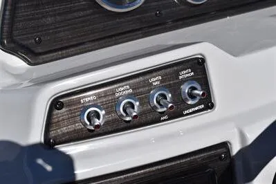 Slide: The Image of Control panel of 2026 Lowe SF 212 Sport Fish boat with labeled switches. - 30