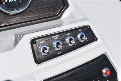 Slide: The Image of Control panel of 2026 Lowe SF 212 Sport Fish boat with switches and gauge. - 32