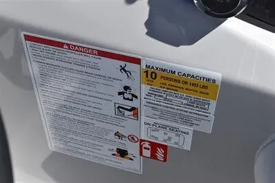 Slide: The Image of Safety and capacity labels on 2026 Lowe SF 212 Sport Fish boat. - 34