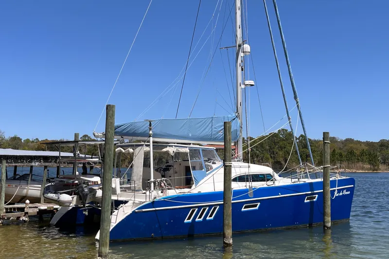The Image of Blue 2008 Broadblue 415 catamaran docked at a marina under clear skies. - 0