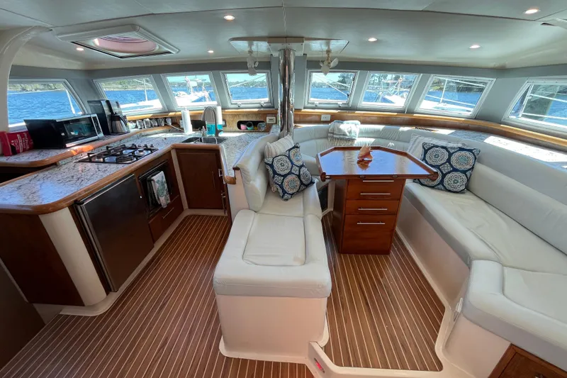 Slide: The Image of Luxurious interior of a 2008 Broadblue 415 catamaran with modern kitchen and seating area. - 16