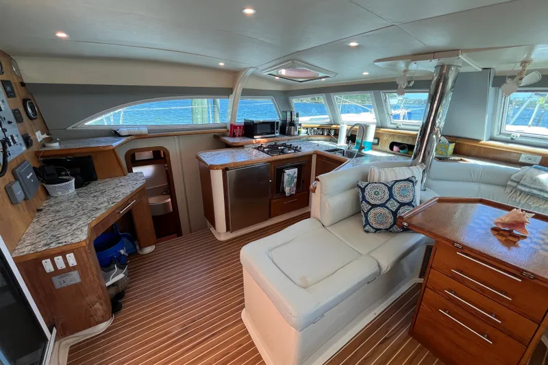 Slide: The Image of Luxurious interior of a 2008 Broadblue 415 catamaran with modern kitchen and cozy seating. - 17