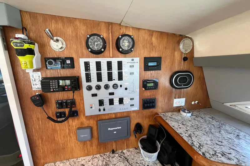 Slide: The Image of Control panel of a 2008 Broadblue 415 catamaran with navigation and communication equipment. - 18