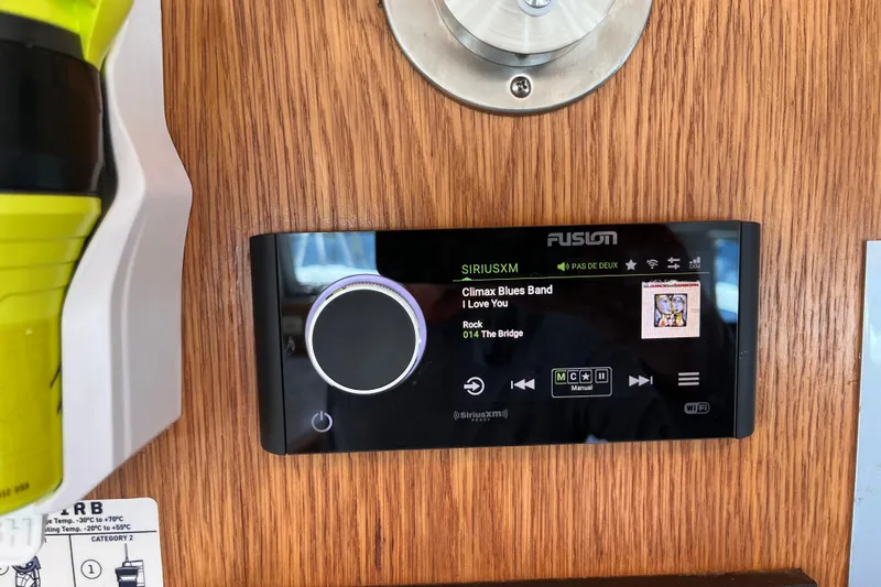 Slide: The Image of Fusion stereo system on a 2008 Broadblue 415 catamaran, playing SiriusXM. - 20
