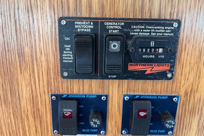 Slide: The Image of Control panel of a 2008 Broadblue 415 with generator and bilge pump switches. - 22