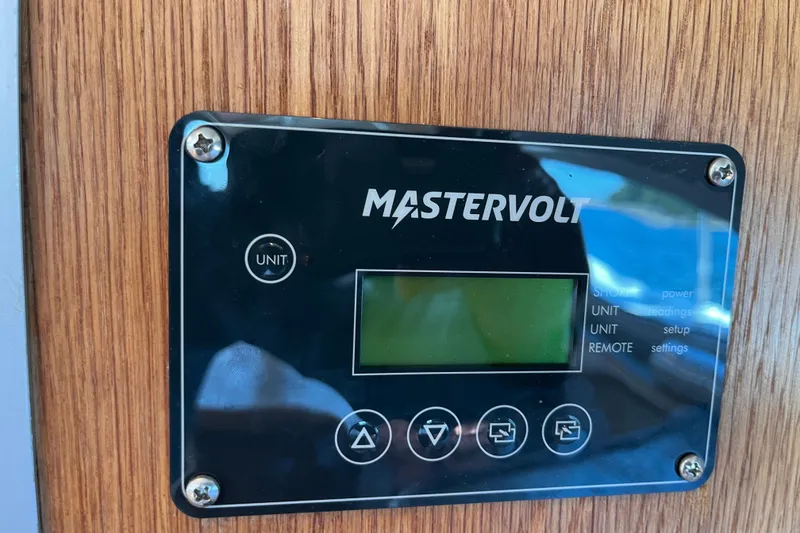 Slide: The Image of Mastervolt control panel on 2008 Broadblue 415 yacht, mounted on wooden surface. - 26