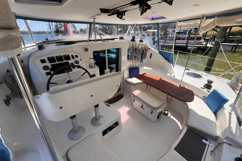 Slide: The Image of Interior view of a 2008 Broadblue 415 catamaran, featuring helm and seating area. - 3
