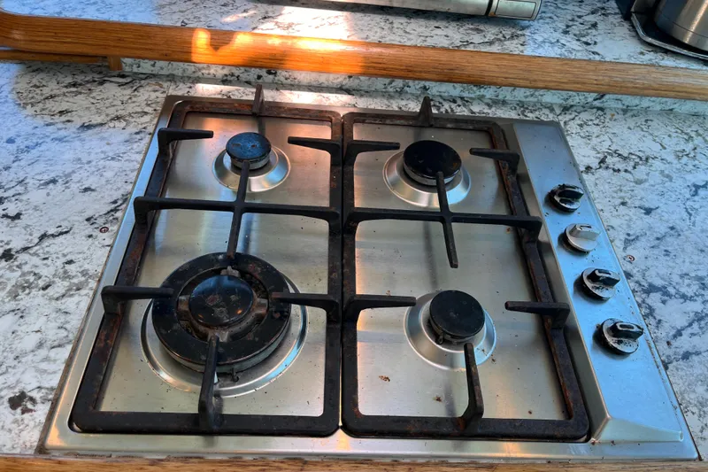 Slide: The Image of Four-burner gas stove on a Broadblue 415, 2008 model, with granite countertop. - 33
