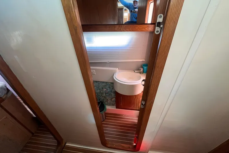 Slide: The Image of Interior of 2008 Broadblue 415 yacht bathroom with wooden accents and compact sink. - 37