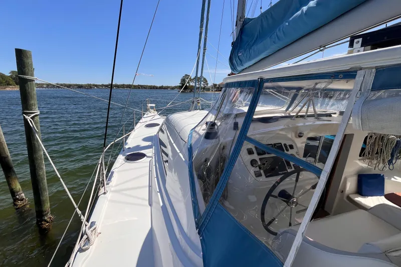 Slide: The Image of 2008 Broadblue 415 catamaran docked, showcasing cockpit and deck with clear skies. - 4