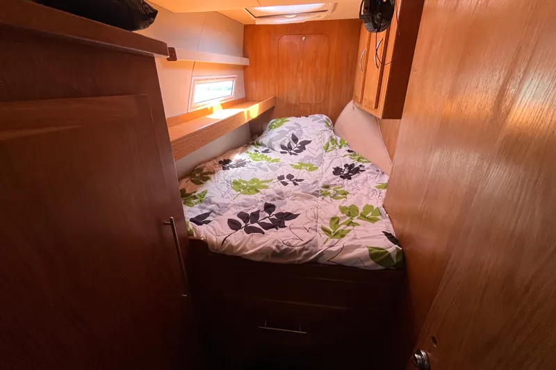 Slide: The Image of Cozy cabin interior of 2008 Broadblue 415 catamaran with floral bedding and wooden finish. - 40