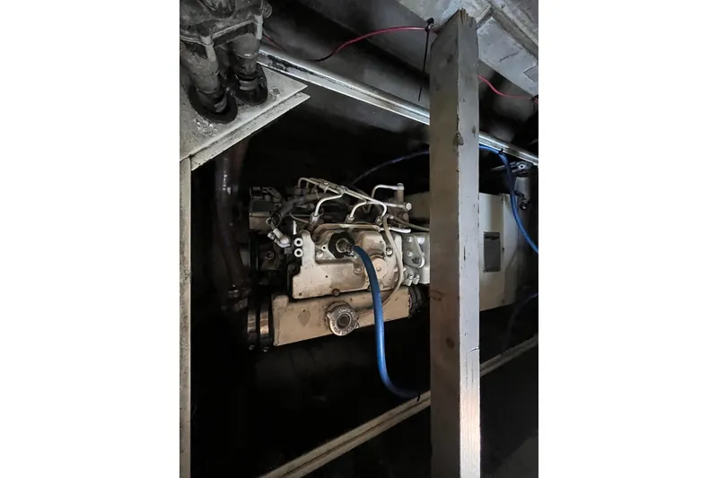 Slide: The Image of Engine compartment of a 2008 Broadblue 415 catamaran, showcasing mechanical components and wiring. - 41