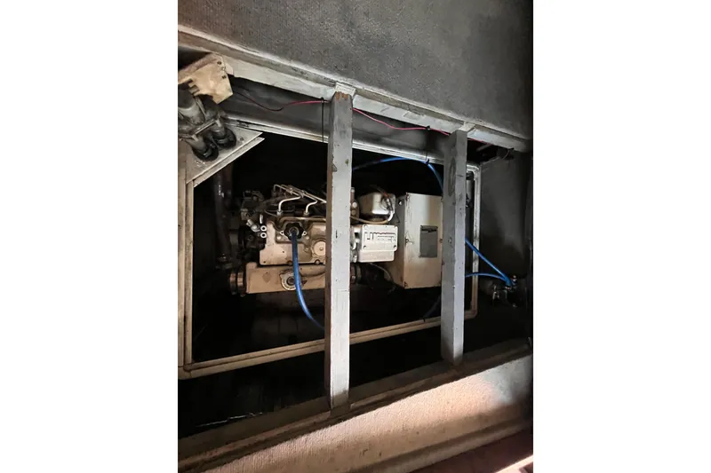 Slide: The Image of Engine compartment of a 2008 Broadblue 415 catamaran, showcasing mechanical components and wiring. - 42