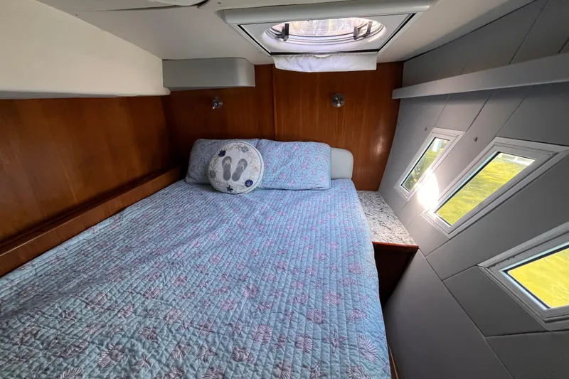Slide: The Image of Cozy cabin interior of 2008 Broadblue 415 catamaran with skylight and patterned bedding. - 43