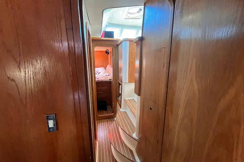 Slide: The Image of Interior of 2008 Broadblue 415 yacht with wooden paneling and cozy cabin. - 45