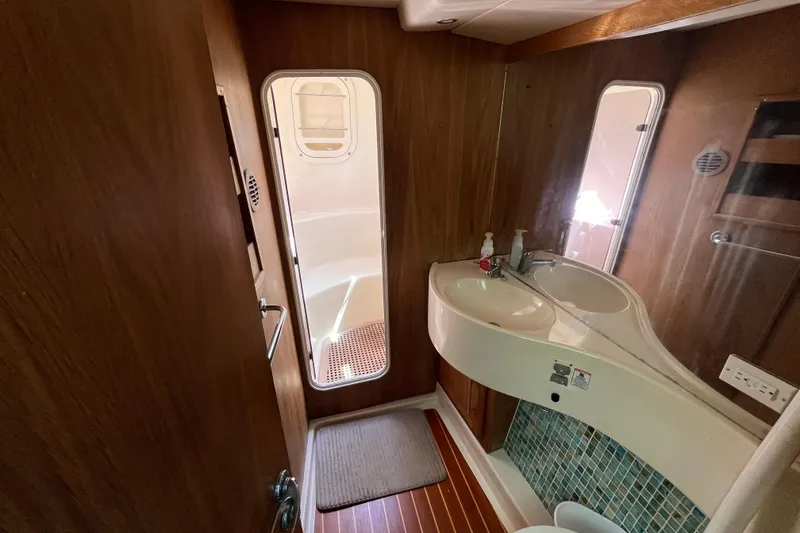 Slide: The Image of Interior of 2008 Broadblue 415 yacht bathroom with wooden paneling and modern fixtures. - 47