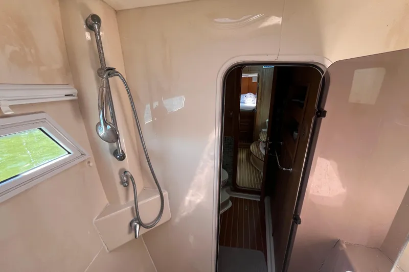 Slide: The Image of Interior of 2008 Broadblue 415 yacht featuring shower and cabin doorway. - 49