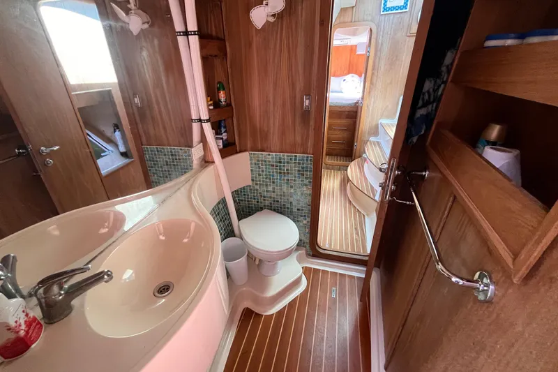 Slide: The Image of Interior of 2008 Broadblue 415 yacht bathroom with wooden finish and modern amenities. - 50
