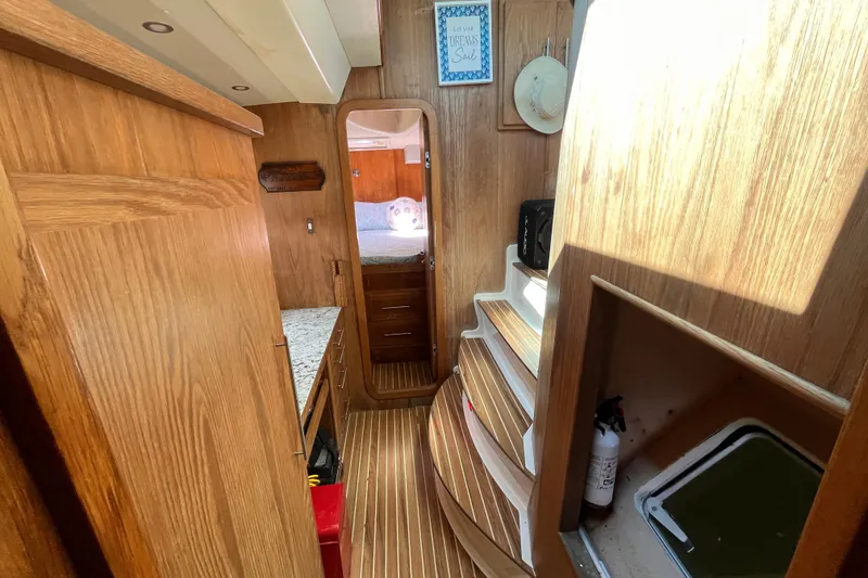 Slide: The Image of Interior of 2008 Broadblue 415 yacht with wooden cabinetry and cozy sleeping area. - 51