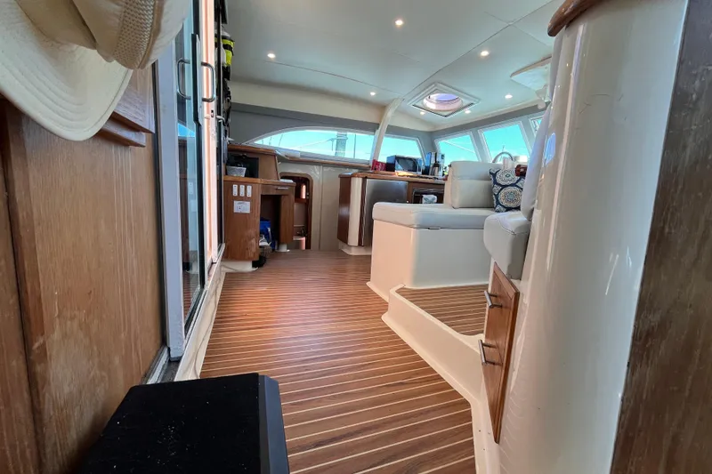 Slide: The Image of Interior of 2008 Broadblue 415 catamaran, featuring wood flooring and comfortable seating. - 55