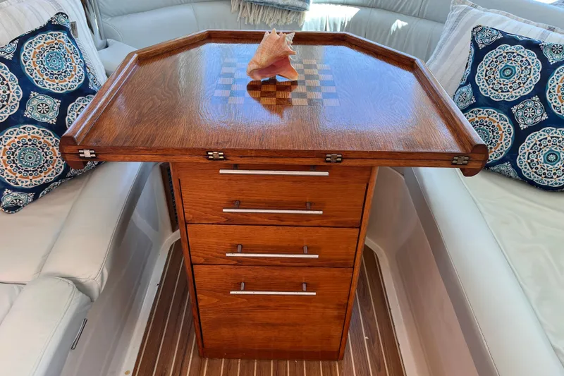 Slide: The Image of Luxurious wooden table with drawers on a 2008 Broadblue 415 yacht interior. - 56