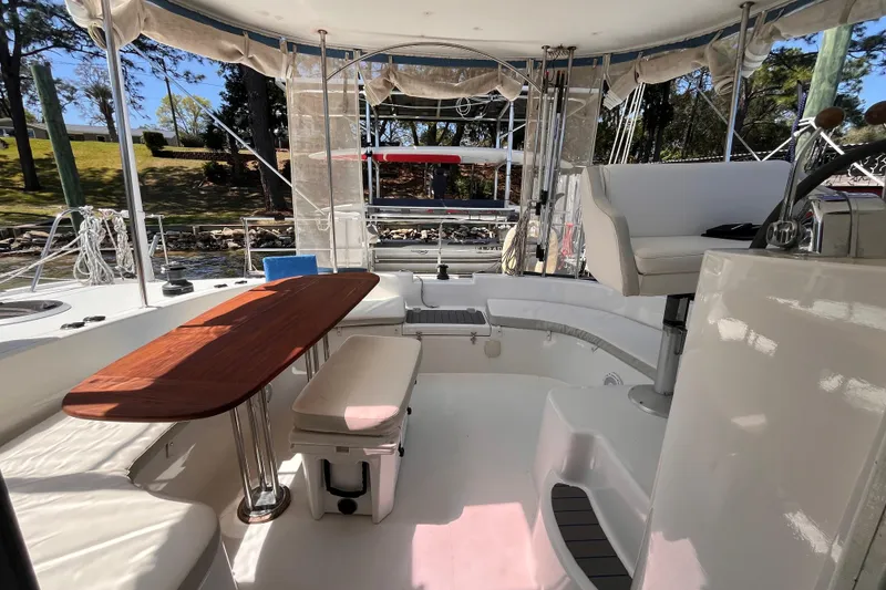 Slide: The Image of Spacious cockpit of a 2008 Broadblue 415 catamaran with seating and wooden table. - 57