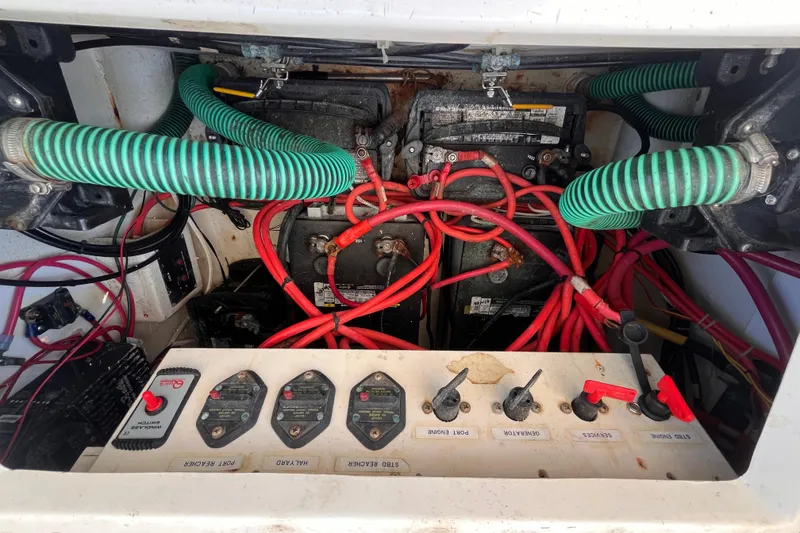 Slide: The Image of Electrical system of a 2008 Broadblue 415 catamaran, featuring batteries and wiring. - 60