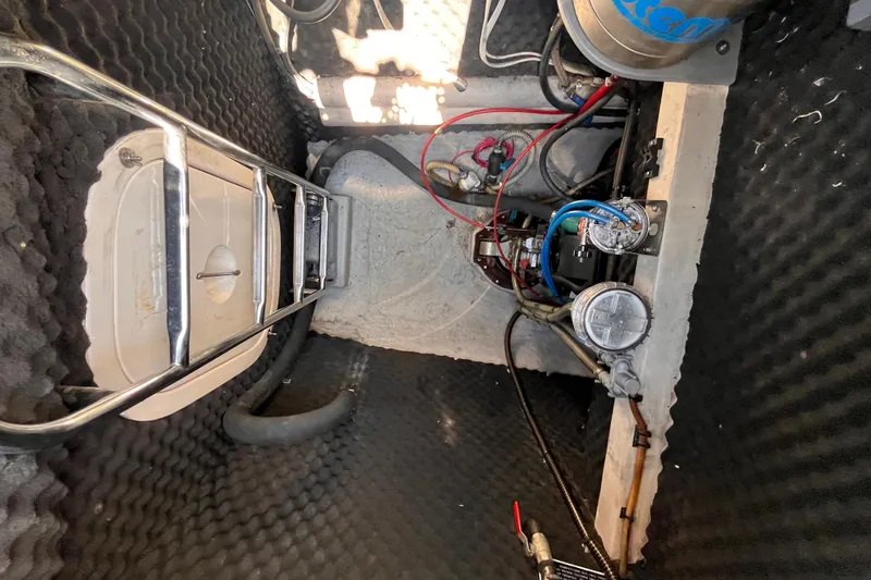 Slide: The Image of Engine compartment of a 2008 Broadblue 415 catamaran with wiring and components. - 61