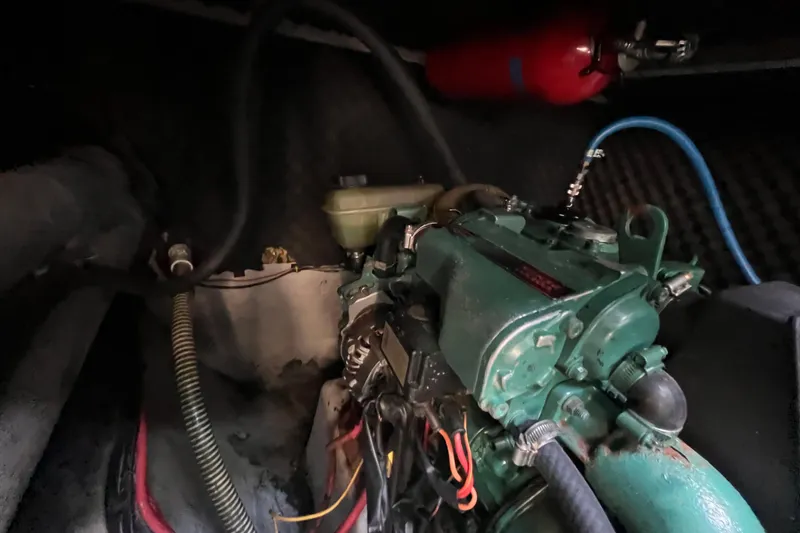 Slide: The Image of Engine compartment of a 2008 Broadblue 415 catamaran, featuring a green marine engine. - 63
