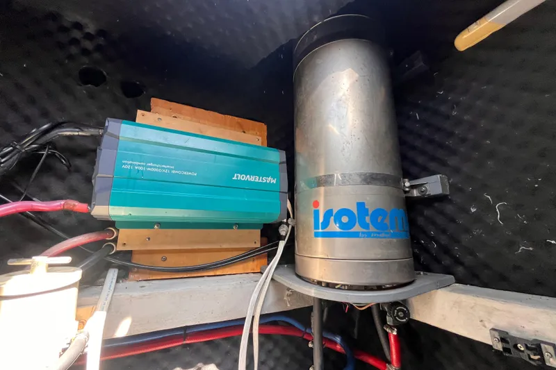 Slide: The Image of Electrical components in a 2008 Broadblue 415, featuring a Mastervolt inverter and Isotemp water heater. - 65