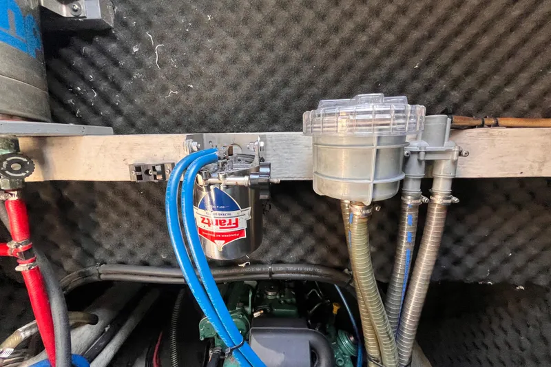 Slide: The Image of Engine compartment of a 2008 Broadblue 415 catamaran with fuel filter and hoses. - 66