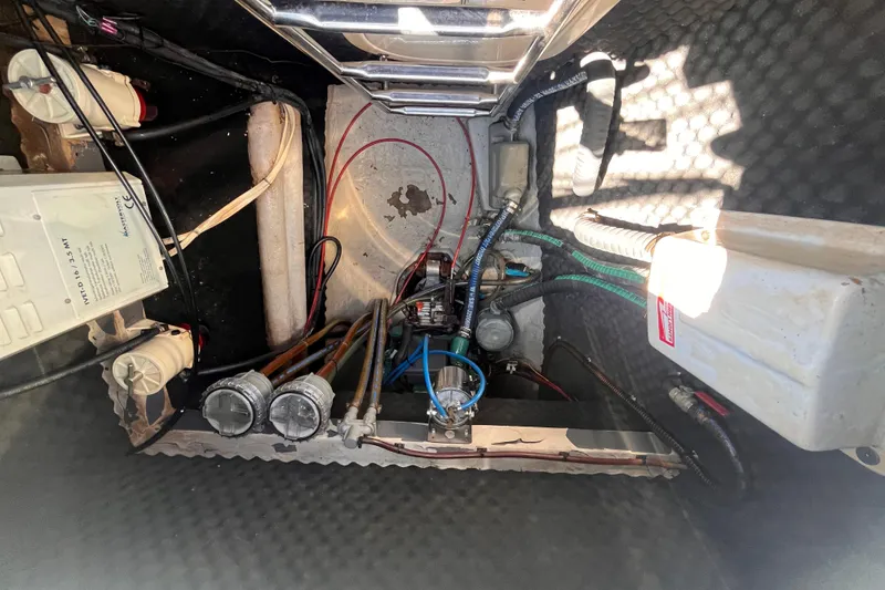 Slide: The Image of Engine compartment of a 2008 Broadblue 415 catamaran, showcasing wiring and mechanical components. - 71