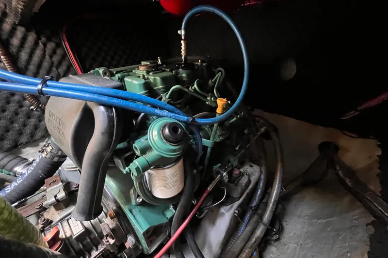 Slide: The Image of Engine compartment of a 2008 Broadblue 415 catamaran, featuring a Volvo Penta engine. - 76