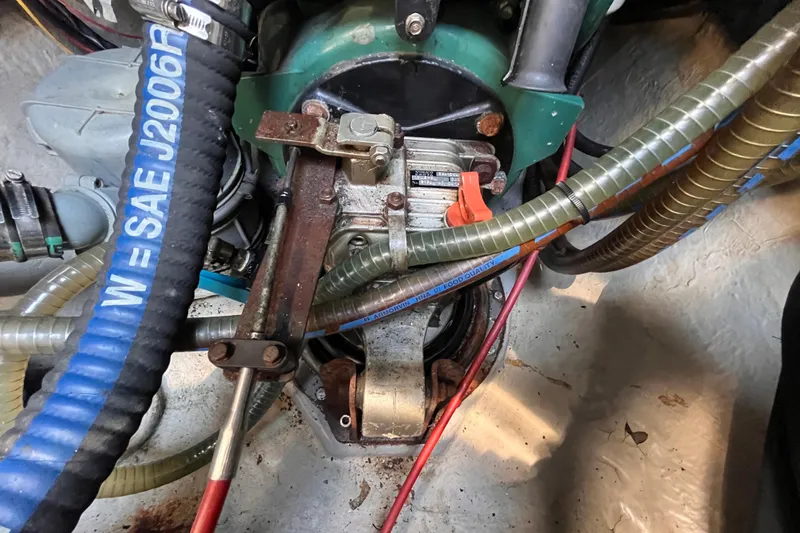 Slide: The Image of Engine compartment of a 2008 Broadblue 415 catamaran with visible hoses and components. - 77