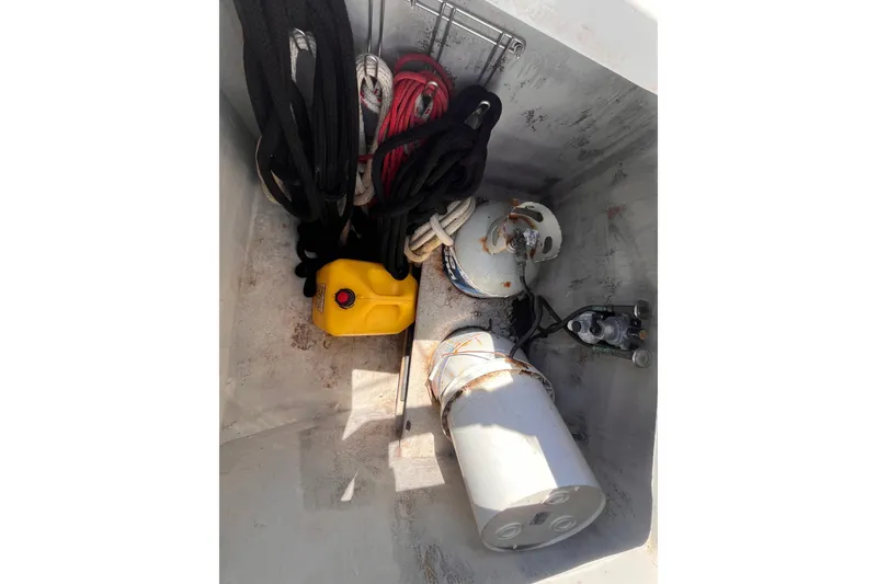 Slide: The Image of Storage compartment of a 2008 Broadblue 415 boat with ropes and equipment. - 8
