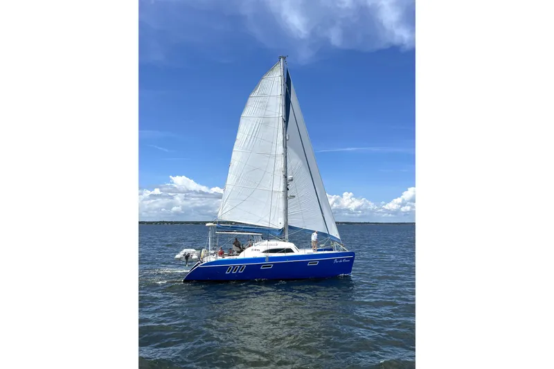 Slide: The Image of Blue Broadblue 415 catamaran sailing on open water under clear skies, 2008 model. - 81