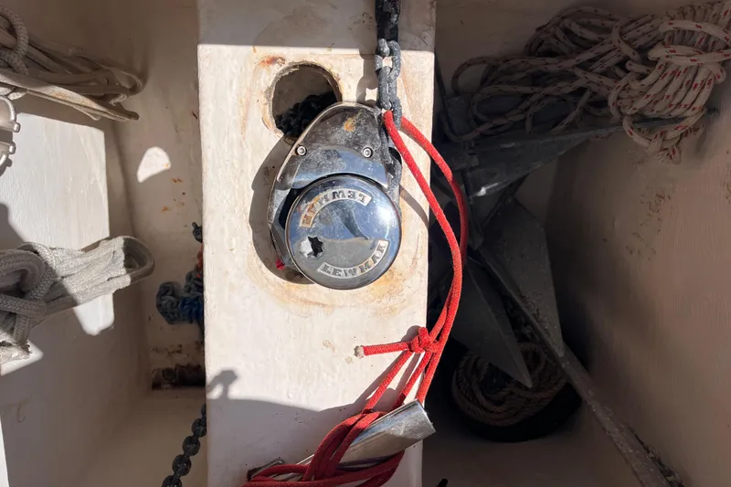 Slide: The Image of Anchor chain mechanism on a 2008 Broadblue 415 catamaran, featuring ropes and nautical equipment. - 9