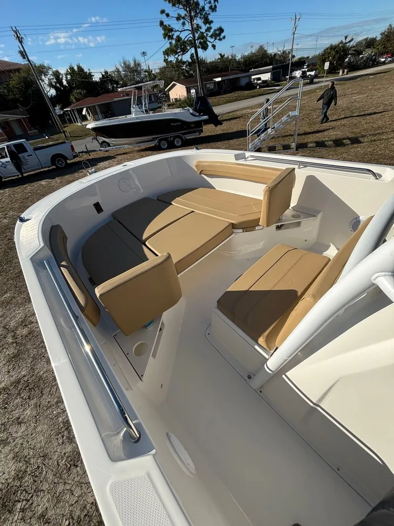 Slide: The Image of Interior view of 2025 Trophy T24 CC boat with beige seating. - 10