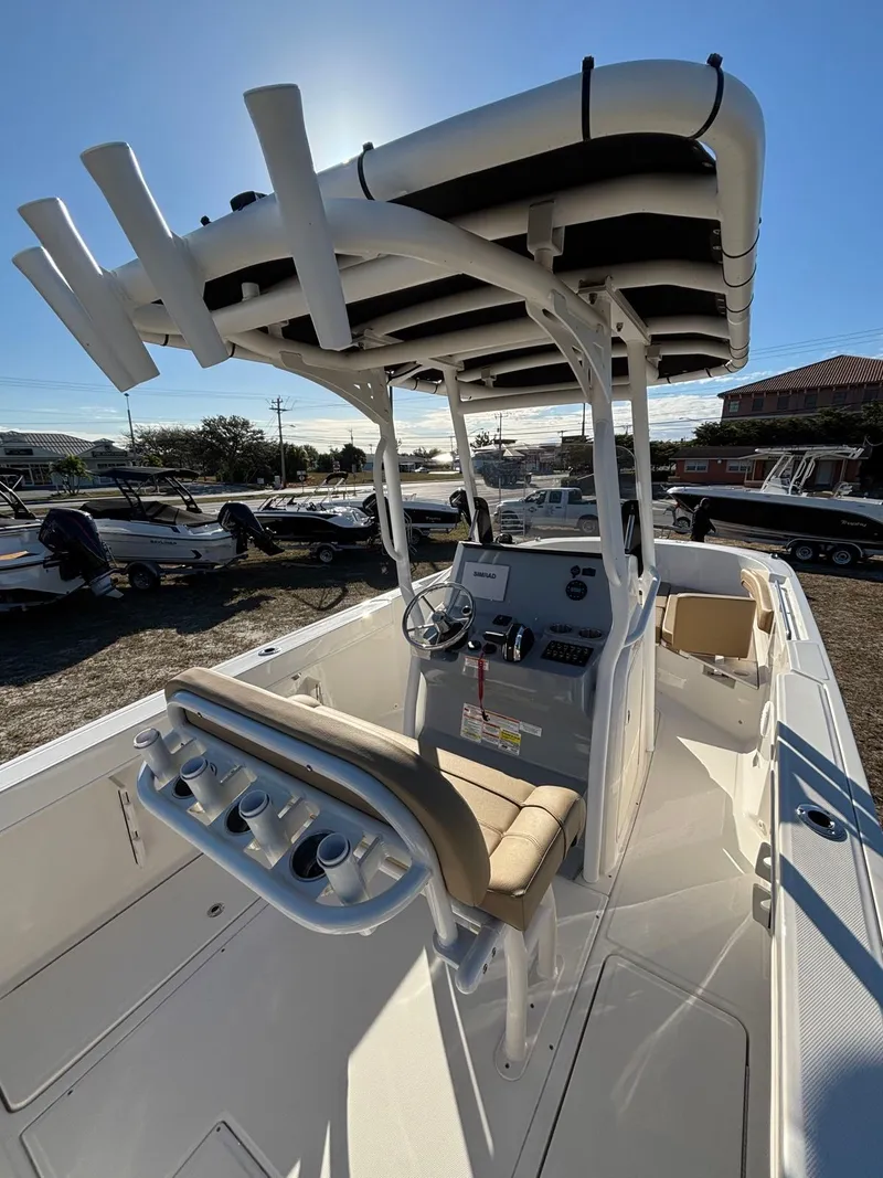 Slide: The Image of 2025 Trophy T24 CC boat with helm station and rod holders. - 3