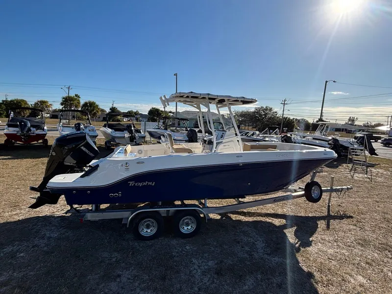 Slide: The Image of 2025 Trophy T24 CC boat on trailer outdoors. - 4