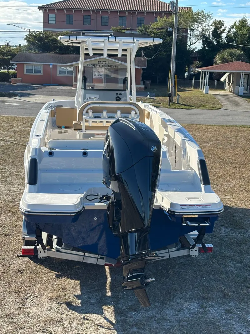 Slide: The Image of 2025 Trophy T24 CC boat with outboard motor on trailer. - 6