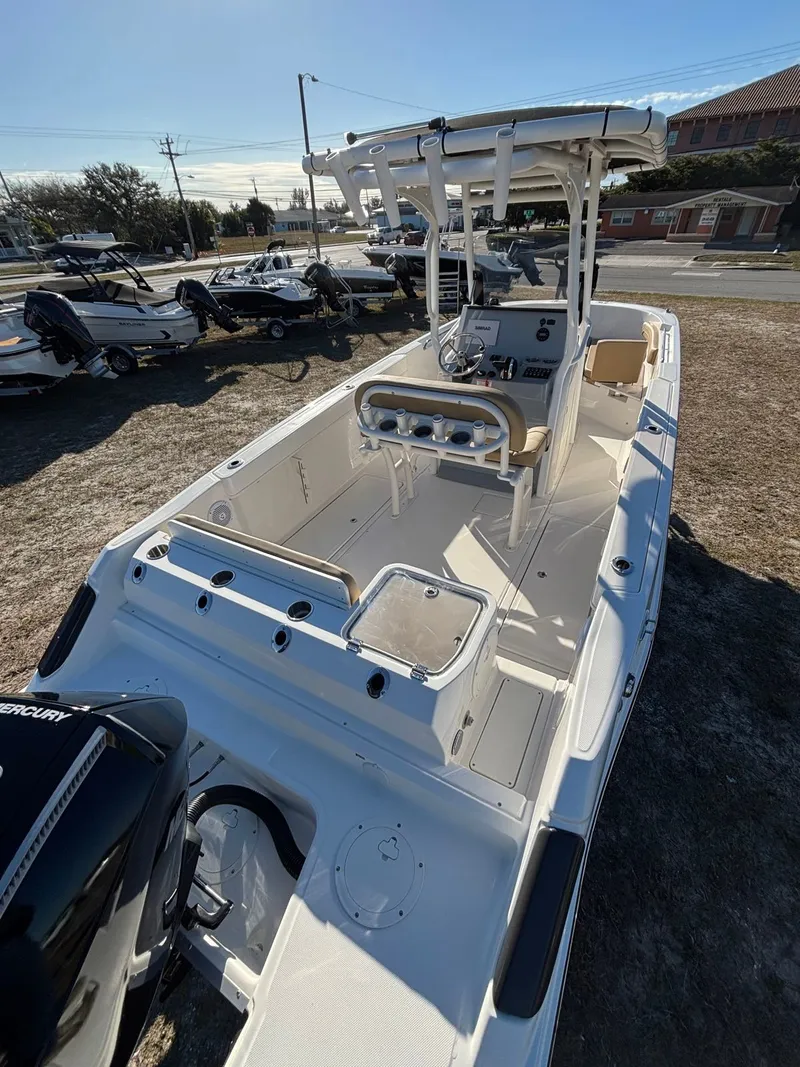 Slide: The Image of 2025 Trophy T24 CC boat parked outdoors. - 7