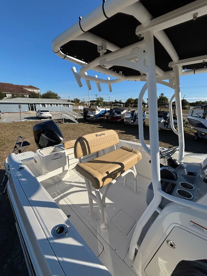 Slide: The Image of 2025 Trophy T24 CC boat with seating area and helm console. - 8