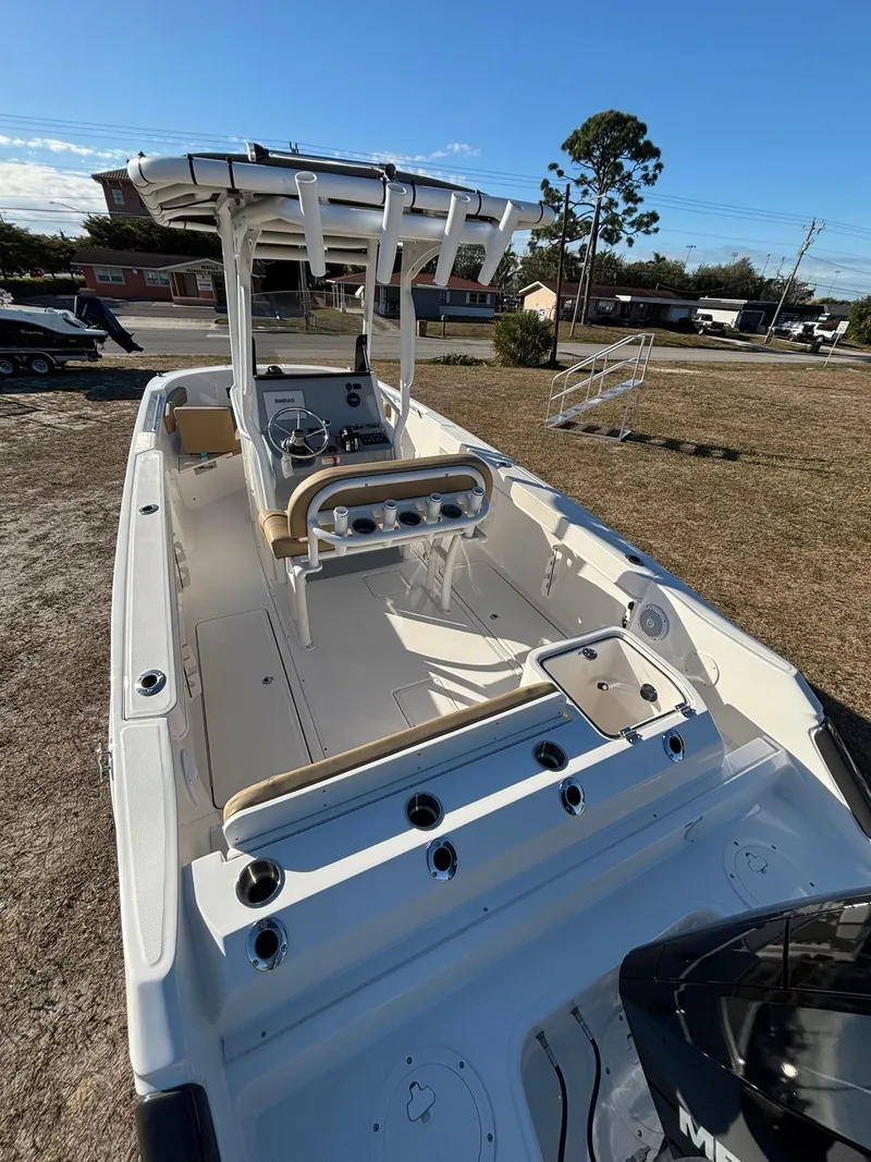 Slide: The Image of 2025 Trophy T24 CC boat with helm and fishing rod holders. - 9