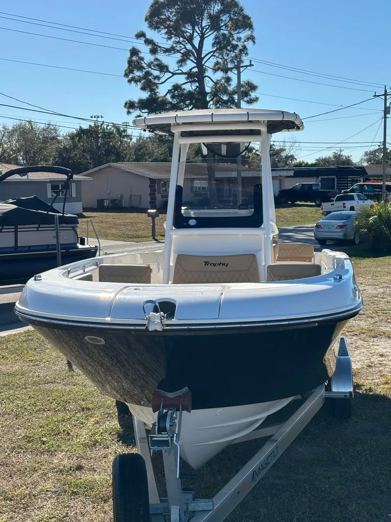 Slide: The Image of 2025 Trophy T24 CC boat on trailer, front view. - 10