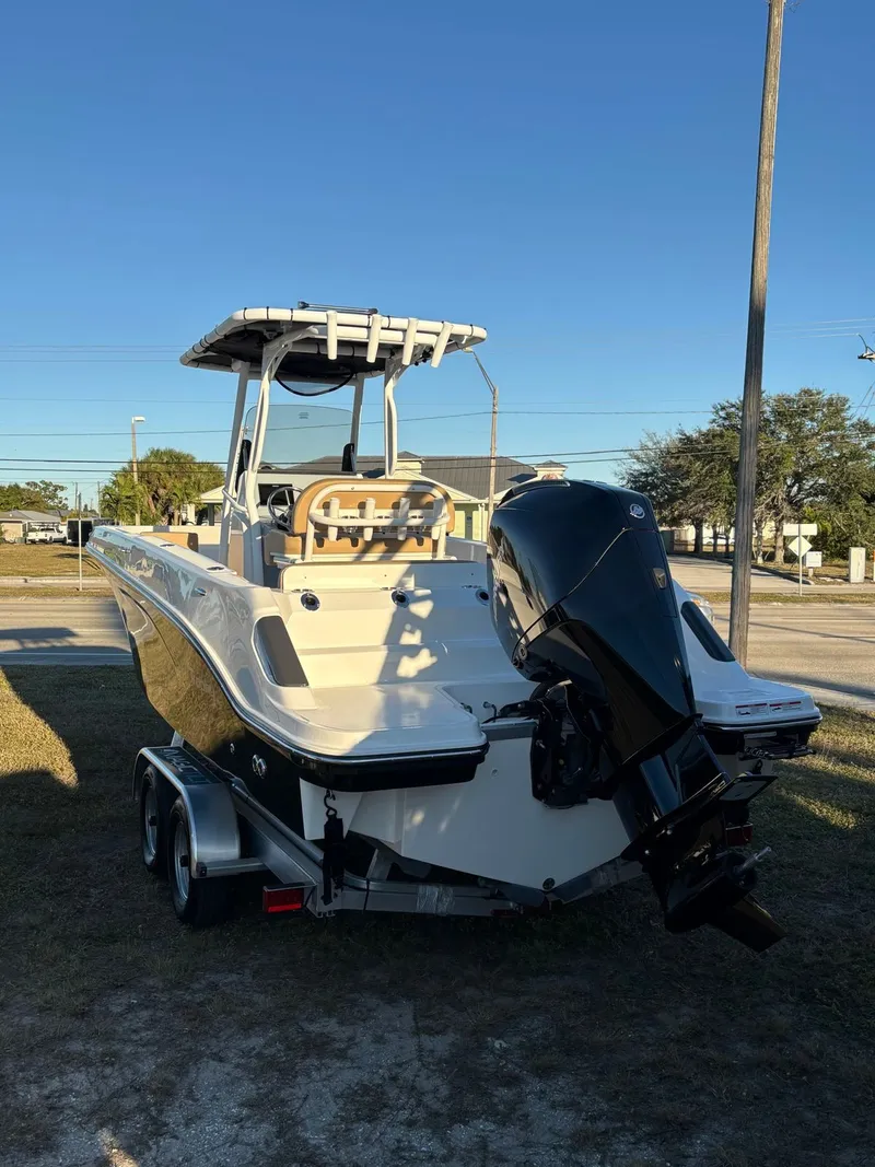 Slide: The Image of 2025 Trophy T24 CC boat on trailer, exterior view. - 11